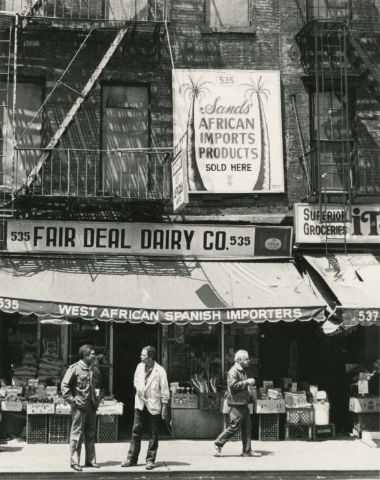 Vintage black and white photo of a storefront in Paddy's Market neighborhood.